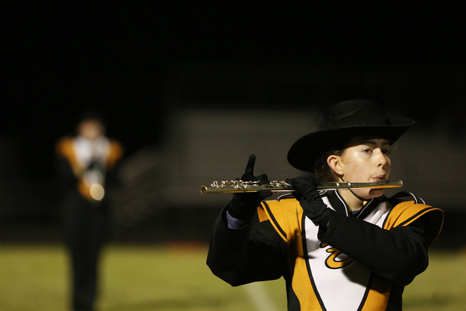 Sydney Hall holds her pinky straight up during their halftime show